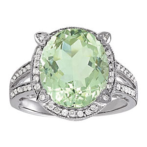 It is a 14 karat white gold Couture ring featuring a beautiful oval green amethyst center stone and 1/3 carat total weight of genuine diamonds.  Retail value of $1,595.00